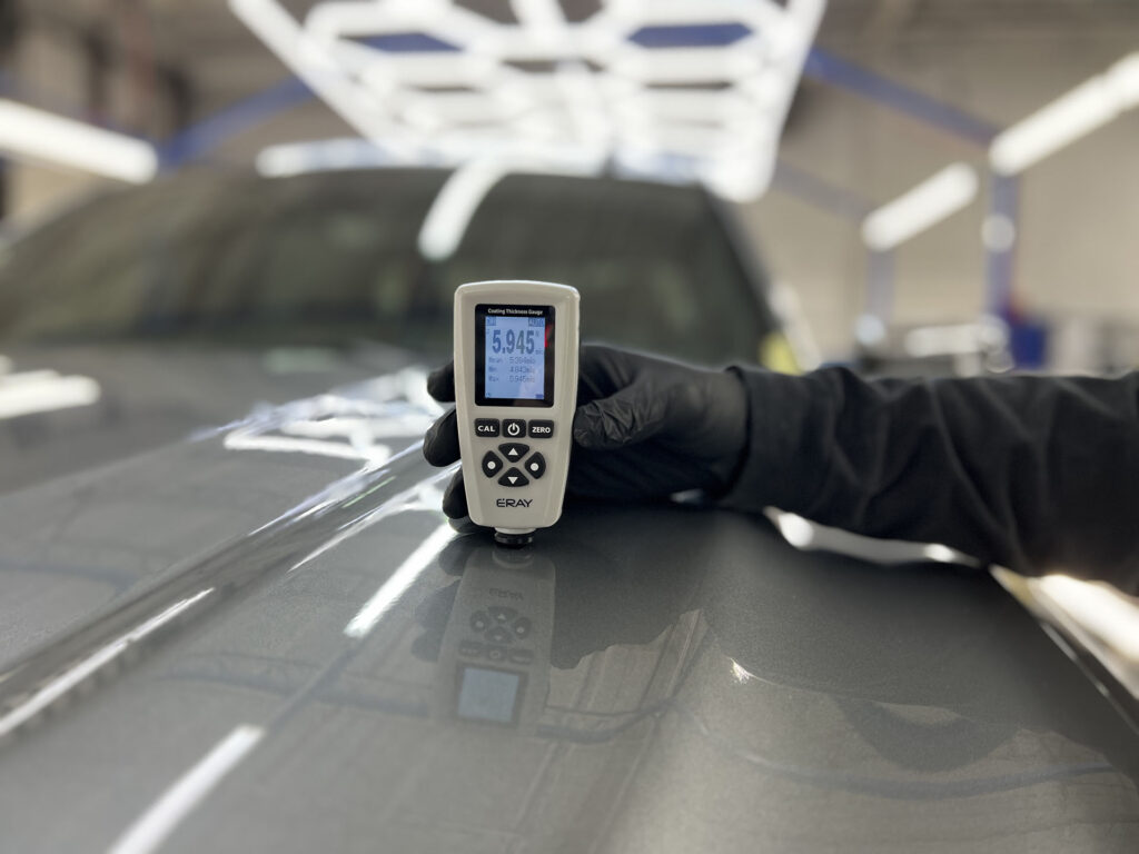 Coating Thickness Gauge on top of a car